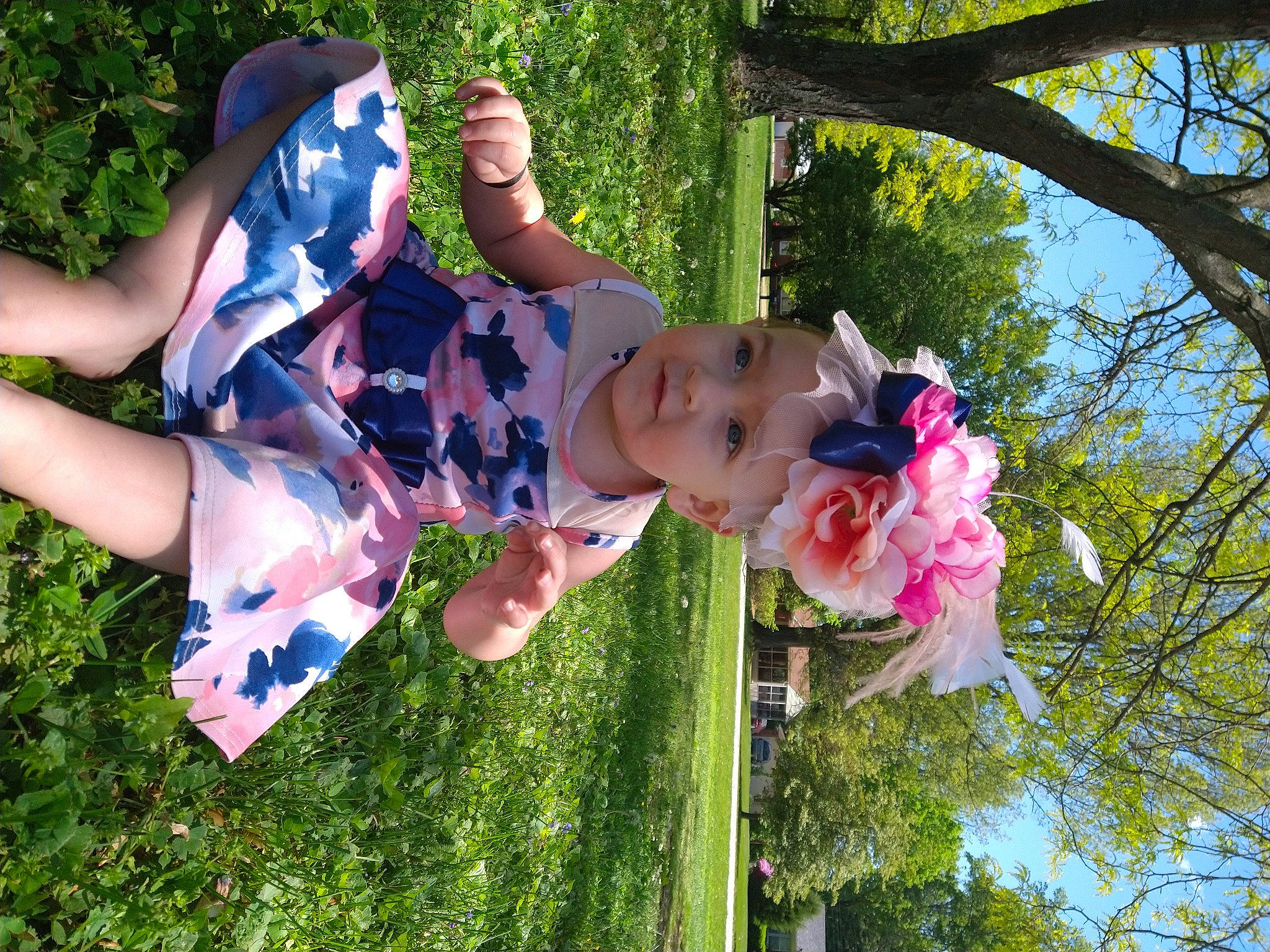 Emma'Lee is registered to the contest to win money with this photo: baby, blossom, child, event, flower, fun, garden, grass, green, happy, headwear, leisure, people_in_nature, person, petal, pink, plant, play, recreation, sky