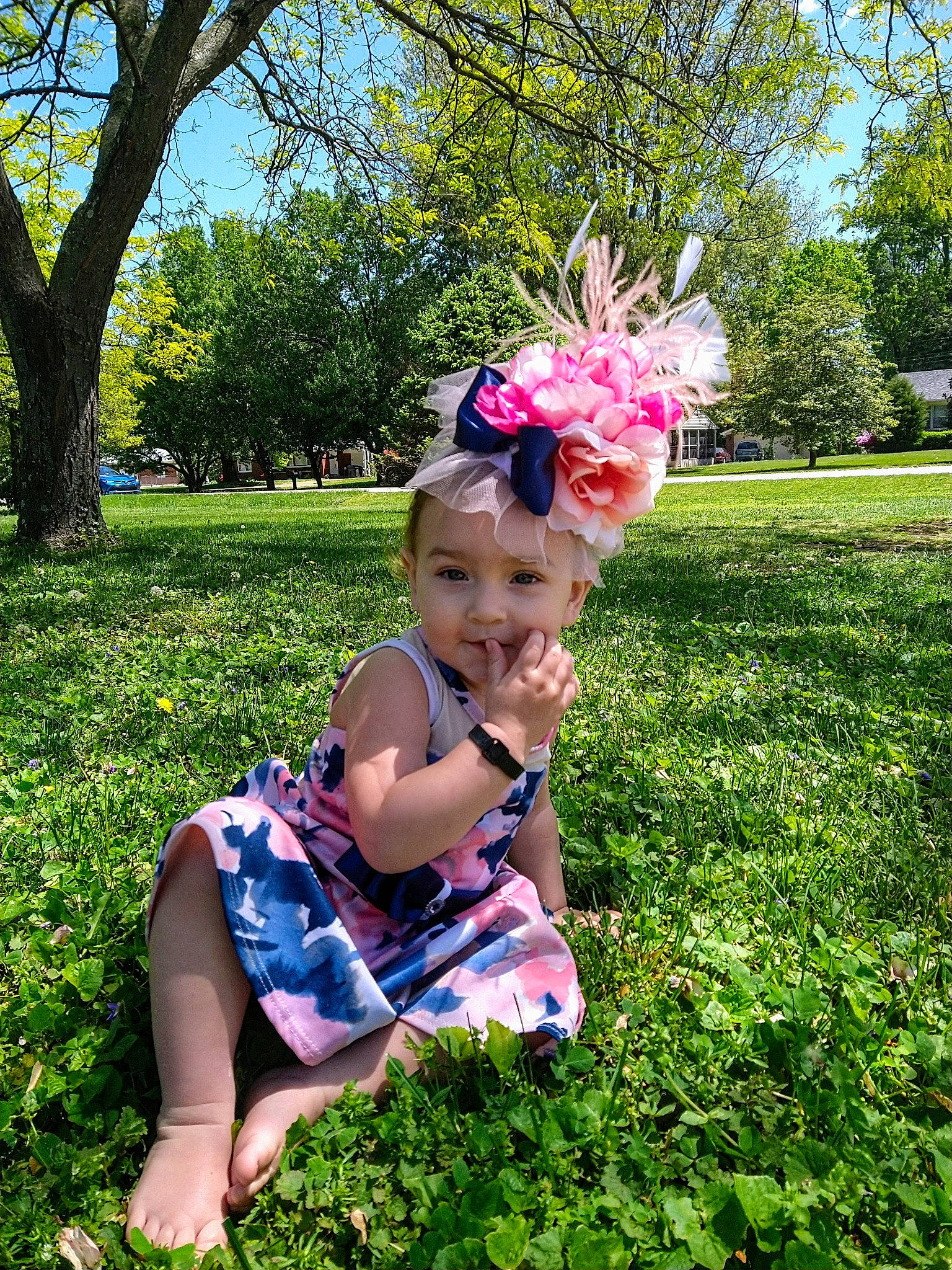 Emma'Lee is registered to the contest to win money with this photo: baby_toddler_clothing, botany, flower, grass, grassland, green, groundcover, happy, leaf, light, nature, people_in_nature, person, pink, plant, sky, smile, summer, sunlight, tree