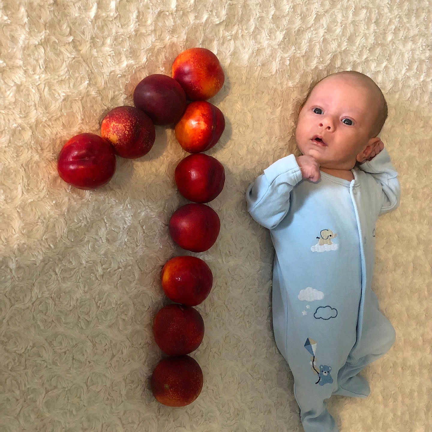 Laurențiu joined the competition — help win amazing prizes! baby, blanket, blue_sleeper, celebration, cute, fruit, fruit_arrangement, indoors, infant, laying_down, nectarines, newborn, number_one, pattern, person, skin, sleepwear, soft_texture, still_life, young_child