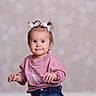 toddler, child, girl, pigtails, hair_bows, pink_sweatshirt, denim_jeans, smiling, portrait, indoor, cute, happy, baby, person, studio, fashion, casual_wear, bokeh_background, light, posing