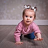 toddler, child, baby, crawling, floor, wooden_floor, pink_sweater, blue_jeans, white_bows, hair_ties, indoor, portrait, cute, curious, reaching_hand, person, young_child, face, eyes, smiling