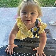 Gabriel joined the competition — help win amazing prizes! toddler, child, yellow_dress, bow, face, hands, outdoor, grass, concrete, curious, portrait, person, sunlight, blue_eyes, expression, standing, clothing, baby, cute, summer