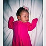 baby, sleeping, pink_clothing, bow, infant, onesie, portrait, white_background, soft_focus, polaroid, cute, rest, child, newborn, peaceful, face, head, human, indoors, blanket
