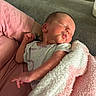 newborn, baby, sleeping, blanket, pink, white, person, arm, couch, soft, cozy, infant, clothing, resting, cute, peaceful, indoors, skin, head, pucker