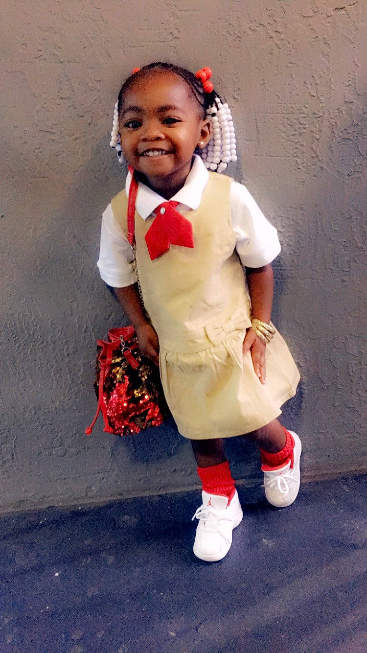 Alani is registered to the contest to win money with this photo: child, costume, joy, person, smile, toddler, uniform