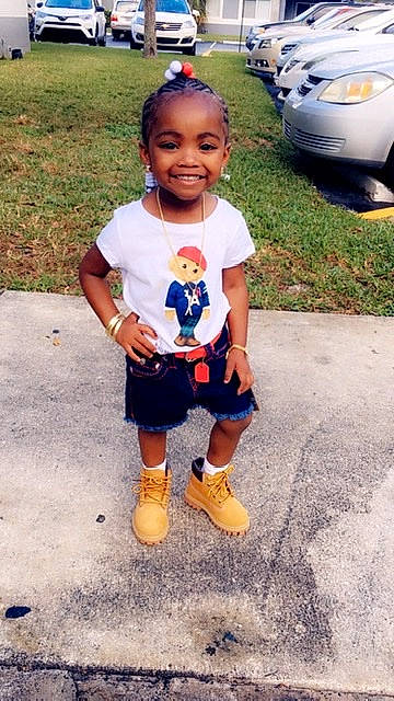 Alani is registered to the contest to win money with this photo: auto_part, baby, blue, child, family_car, footwear, head, joy, people, person, play, shoe, smile, toddler, vacation, yellow