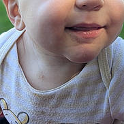 Kekoa is registered to the contest to win money with this photo: baby, child, smiling, face, blue_eyes, close-up, infant, cute, expression, shirt, clothing, cartoon, tiger, striped, skin, natural_light, portrait, happy, young, person