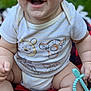 Kekoa joined the competition — help win amazing prizes! baby, smile, onesie, teething_toy, blanket, outdoor, grass, child, happy, cute, infant, person, sitting, skin, legs, hand, face, blue_eyes, toy, clothing