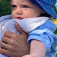 Tyam participe au concours pour gagner de l'argent avec cette photo : accessories, baby, baseballcap, bodypart, bonnet, bracelet, cap, clothing, face, finger, grass, hand, hat, head, jewelry, person, photography, plant, portrait, sunhat