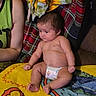 baby, infant, diaper, blanket, colorful, towel, sunflower, person, arm, skin, sitting, indoors, cute, plaid, fabric, couch, relaxed, child, young, casual