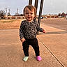 Ivory joined the competition — help win amazing prizes! black_pants, buildings, cars, casual_clothing, child, cloudy_sky, concrete, daytime, leopard_print, long_sleeve_shirt, mismatched_socks, outdoor, person, sidewalk, smiling, standing, suburban, toddler, utility_poles, young_child