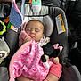 baby, sleeping, car_seat, blanket, plush_toy, pink, infant, child, car_interior, soft_toys, cozy, cute, peaceful, clothing, foot, hand, headrest, seatbelt, resting, comfort