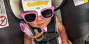 Ivory joined the competition — help win amazing prizes! baby, car_seat, sunglasses, pacifier, infant, child, pink, clothing, harness, seat_belt, cute, sitting, indoors, warning_label, strap, accessory, person, small, funny, packaging