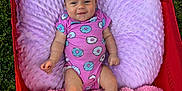 Ivory joined the competition — help win amazing prizes! baby, blanket, child, comfort, cozy, cute, donut_pattern, feet, grass, happy, infant, legs, outdoor, person, pink_onesie, purple_pillow, red_wagon, relaxing, smiling, soft_texture