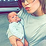 Lillian joined the competition — help win amazing prizes! woman, baby, glasses, selfie, indoor, person, clothing, baby_clothing, floor, footwear, holding, face, expression, store, aisle, shopping, casual, portrait, human, cute