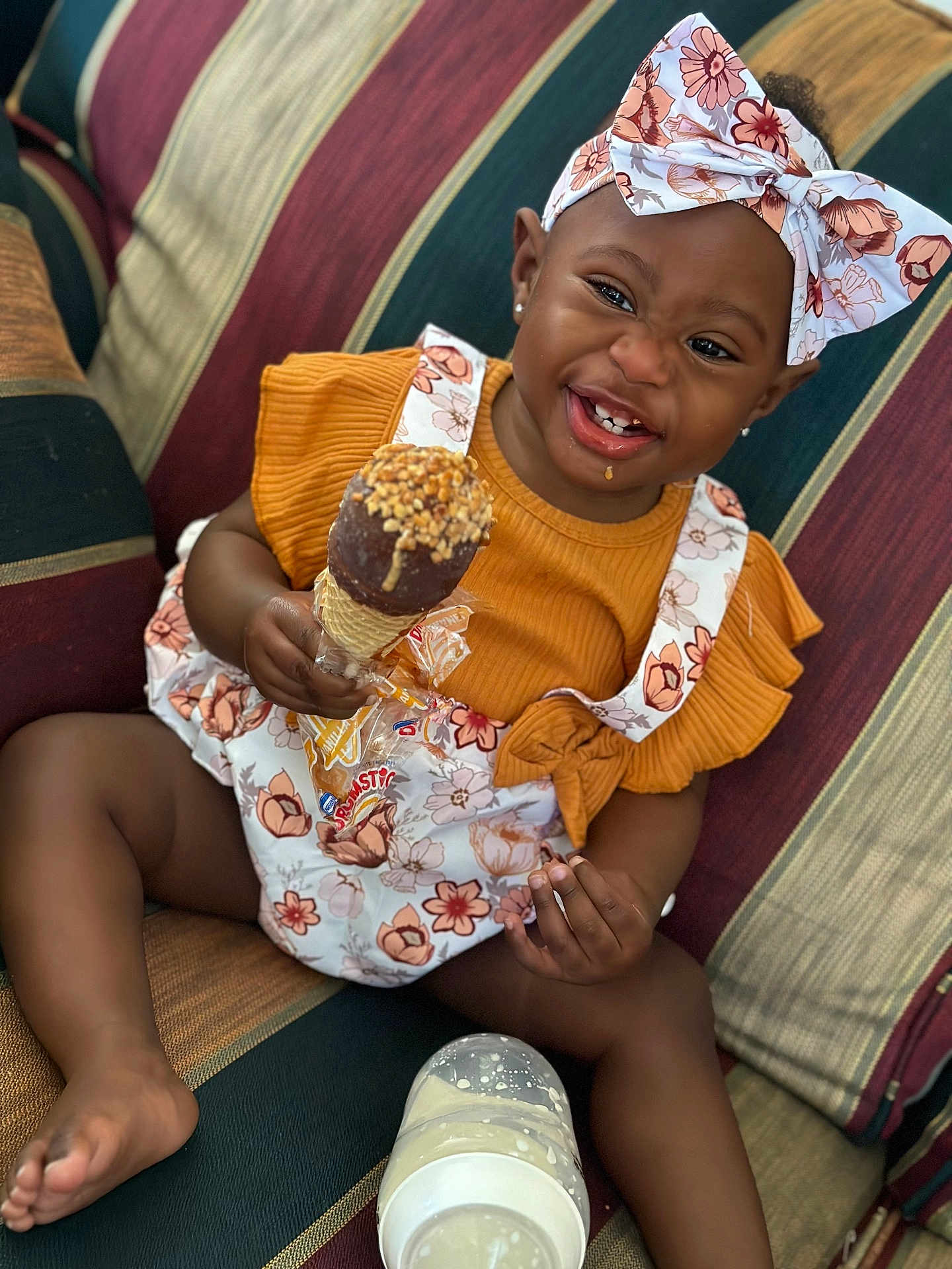 Carly joined the competition — help win amazing prizes! baby, babylaughing, clothing, couch, cream, cutlery, dessert, face, food, furniture, happy, head, icecream, person, photography, portrait, scarf, sitting, smile, spoon