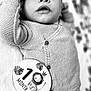 baby, infant, knitwear, hat, milestone_card, blanket, portrait, cute, one_month, black_and_white, lying_down, buttoned_sweater, soft_texture, newborn, face, eyes, expression, child, animal_illustration, cozy
