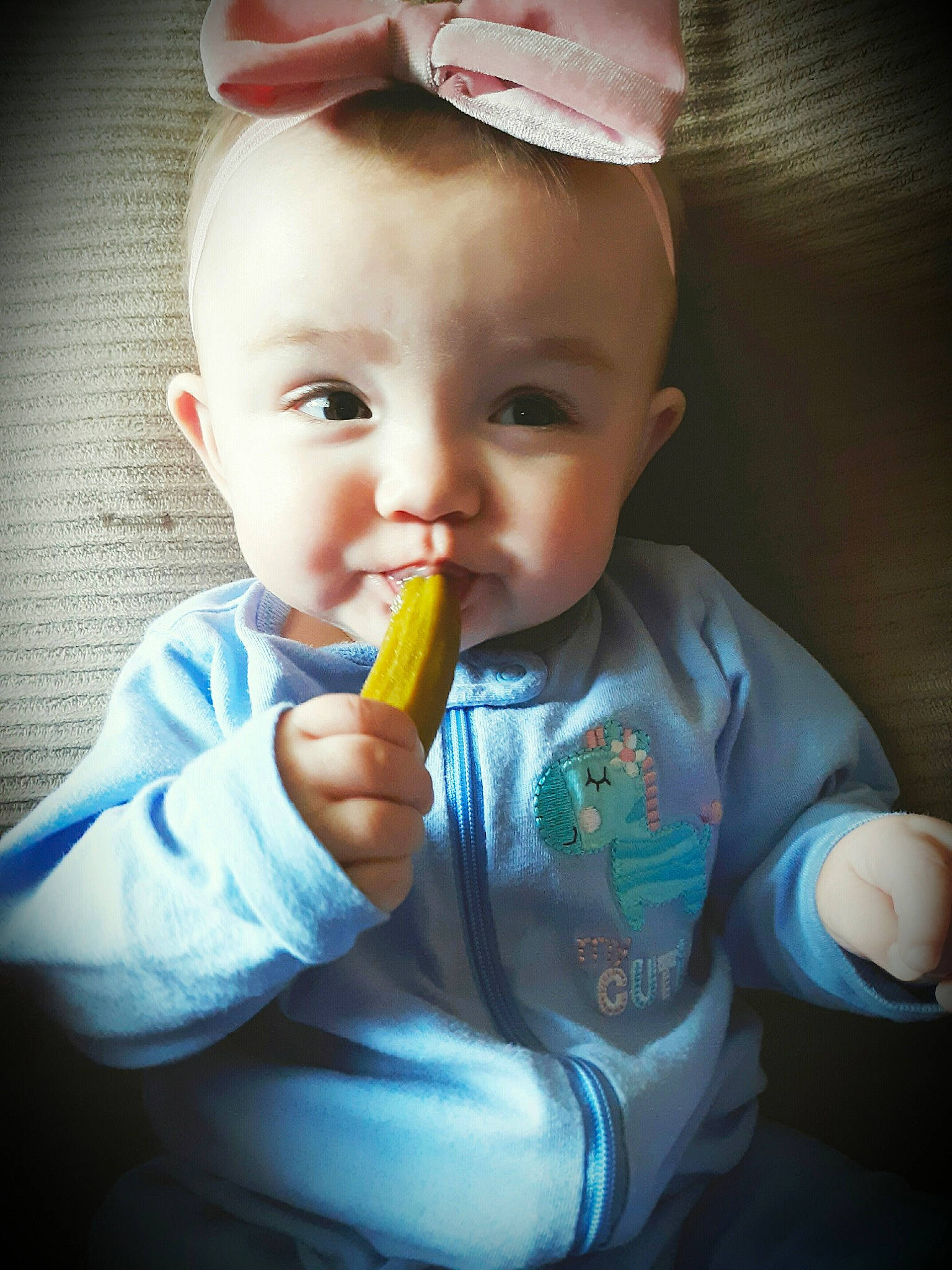 Charlotte is registered to the contest to win money with this photo: baby, child, eating, eye, finger, food, lip, person, product, sweetness, toddler