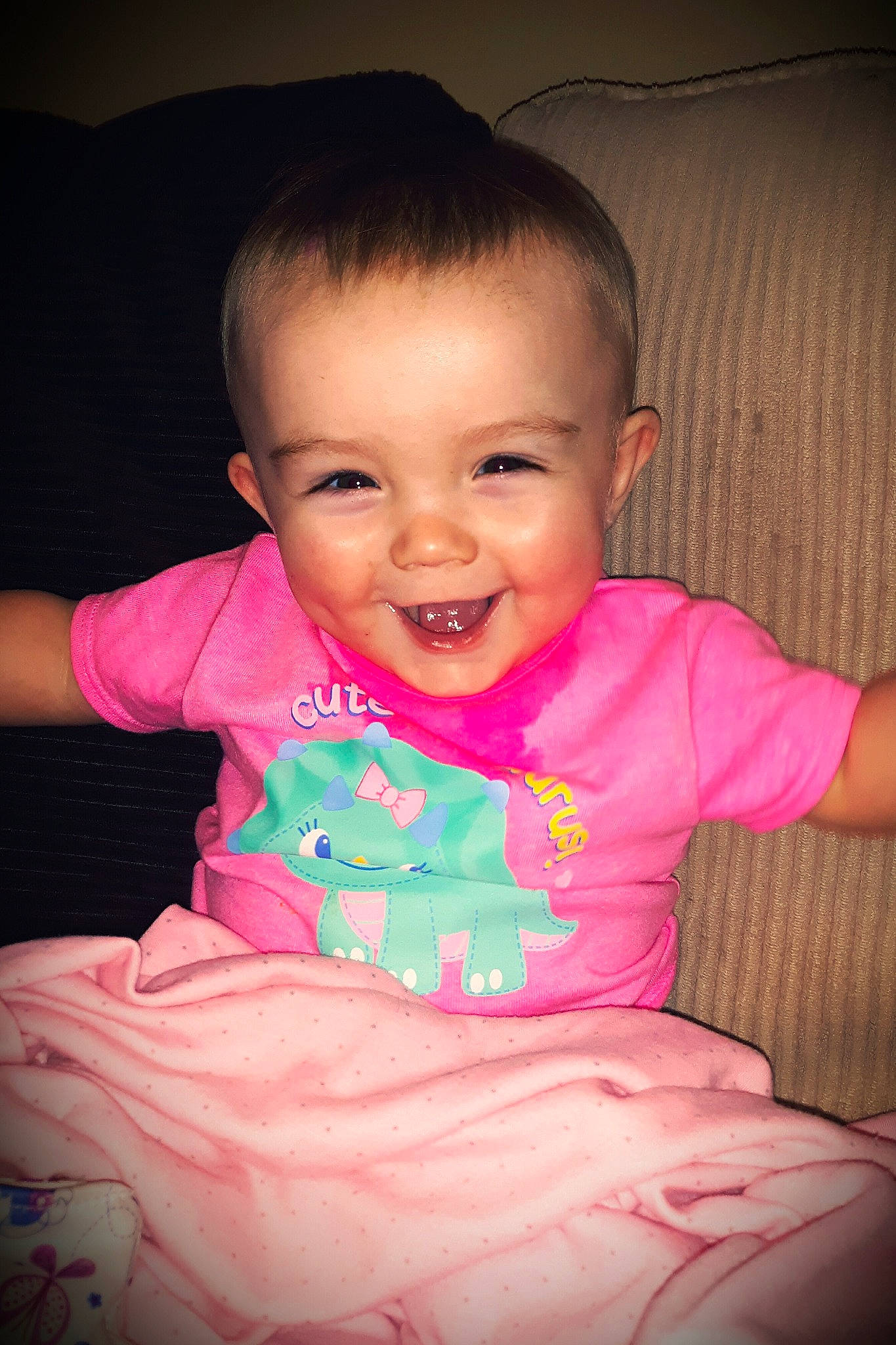 Charlotte is registered to the contest to win money with this photo: baby, baby_toddler_clothing, beauty, cheek, child, chin, eye, face, facial_expression, fun, happy, head, iris, joy, lip, mouth, person, pink, sitting, skin