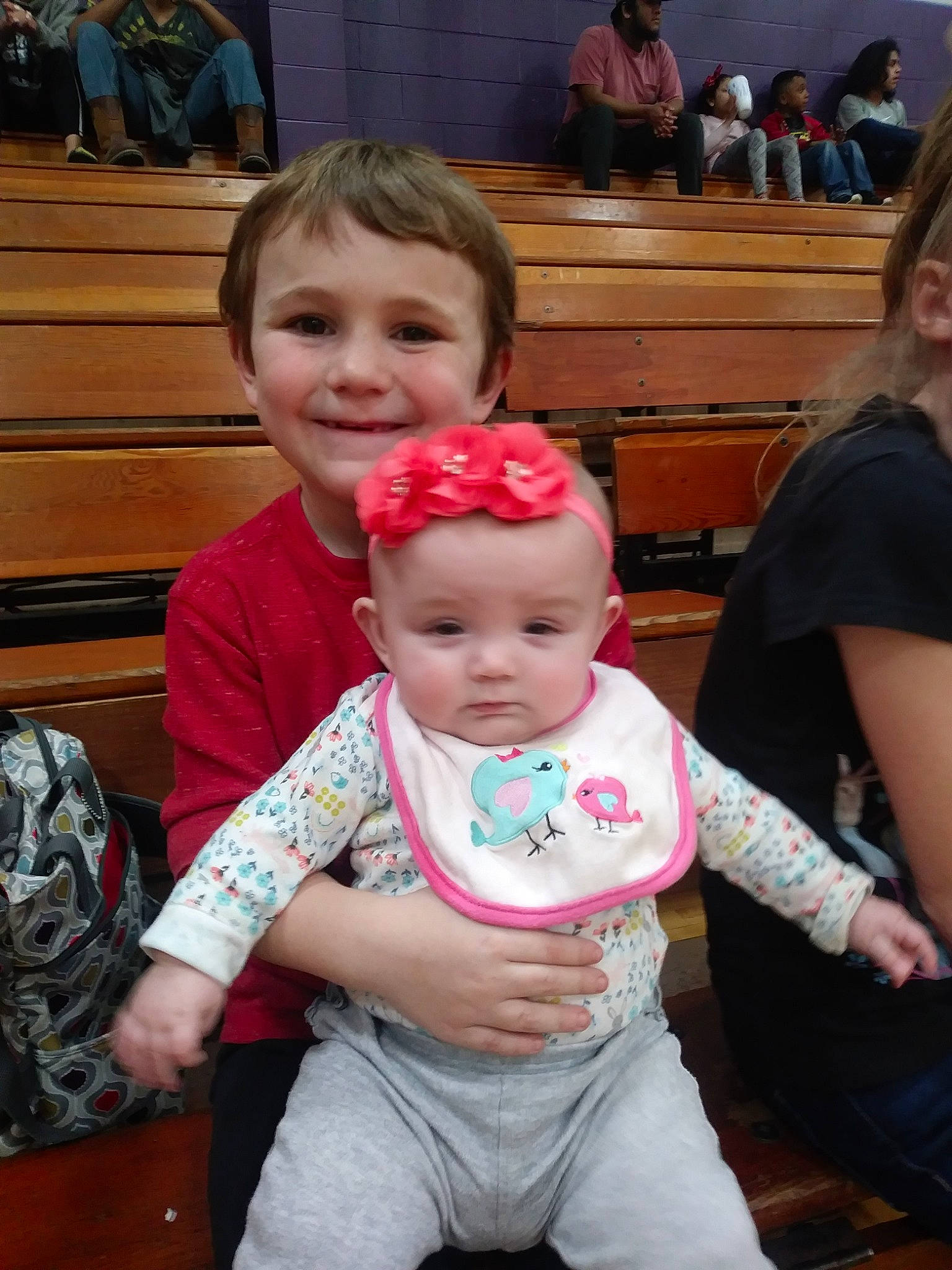 Collyn is registered to the contest to win money with this photo: child, daughter, family, fun, joy, people, person, pink, sitting, toddler