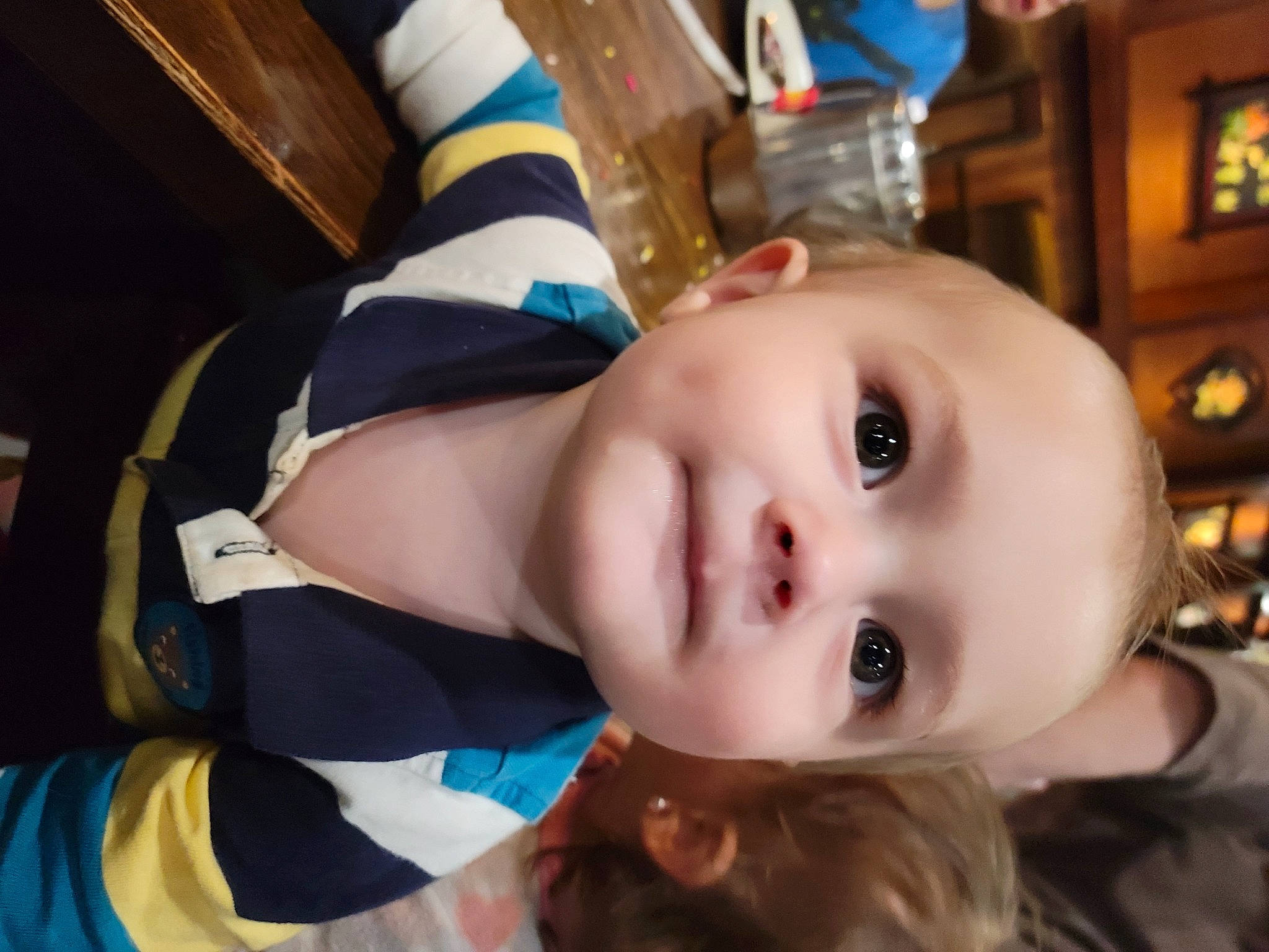 Grayson is registered to the contest to win money with this photo: baby, baby_toddler_clothing, cheek, child, eyebrow, eyelash, fun, happy, iris, lip, nose, person, portrait_photography, smile, toddler, wood