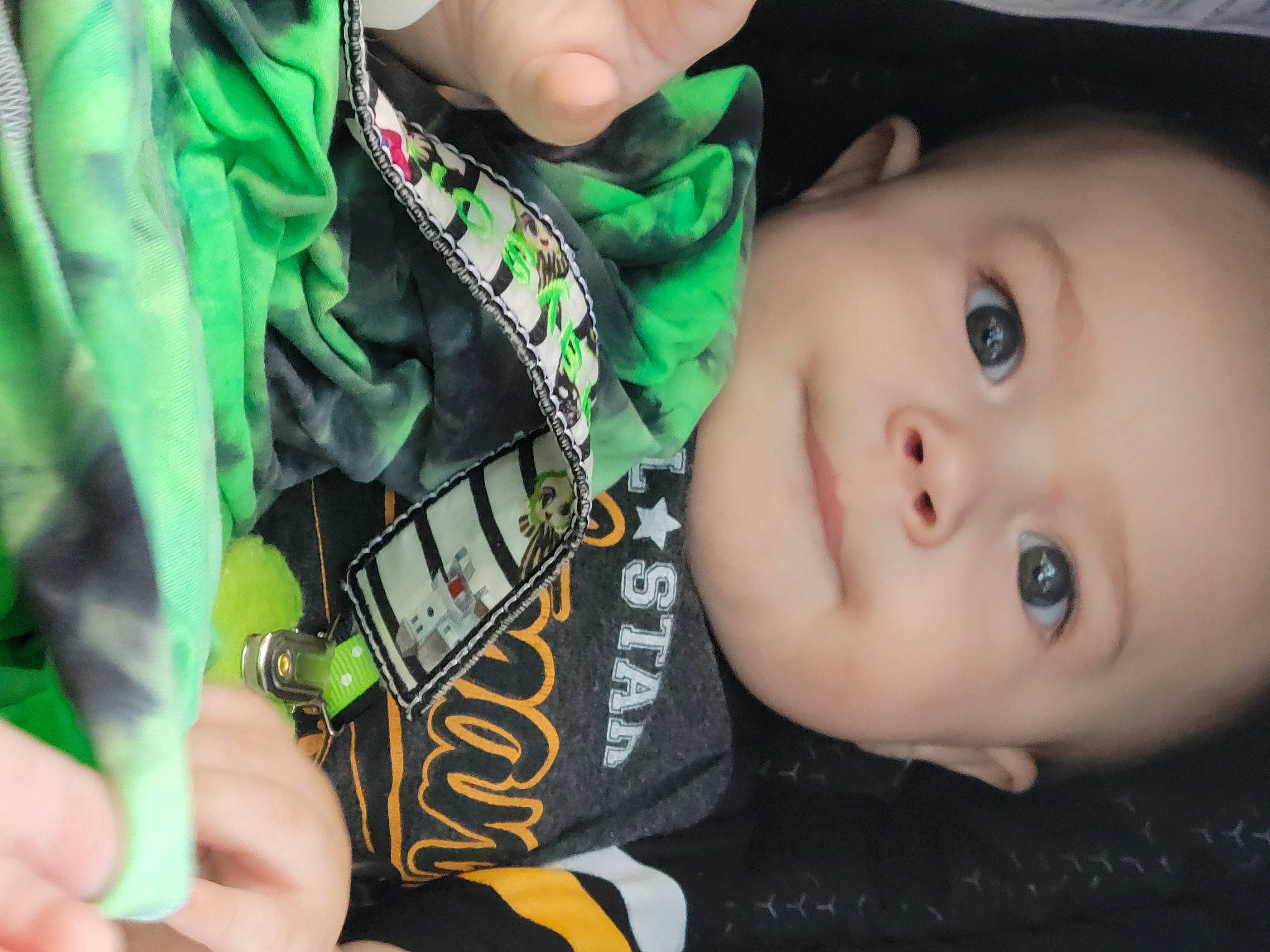 Grayson is registered to the contest to win money with this photo: baby_toddler_clothing, cheek, eye, eyebrow, eyelash, finger, flash_photography, grass, green, hand, happy, iris, lip, mouth, nose, outerwear, person, skin, sleeve, toddler