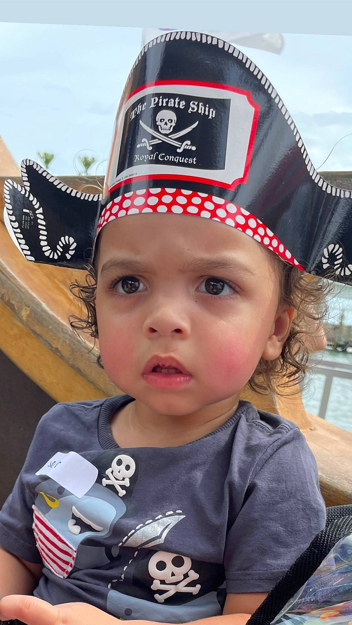 Junior is registered to the contest to win money with this photo: baseball_cap, beanie, cap, child, cool, costume_hat, eye, fashion_accessory, fun, happy, hat, headgear, headwear, logo, outerwear, person, personal_protective_equipment, recreation, sun_hat, t_shirt
