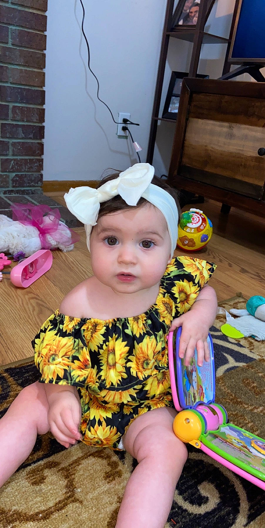 Emrie joined the competition — help win amazing prizes! baby, baby_toddler_clothing, beanie, cap, child, costume, fashion_accessory, fun, happy, head, headband, headgear, headwear, pattern, person, play, purple, sitting, sleeve, t_shirt