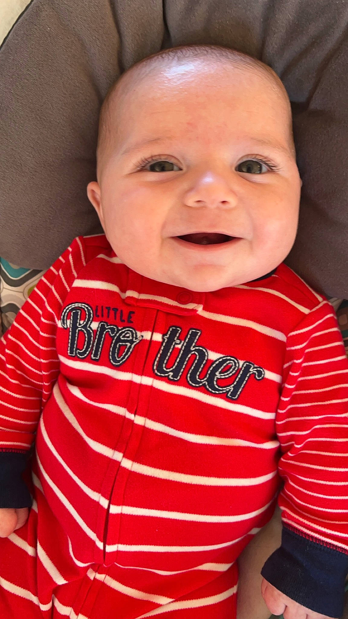 Bentley is registered to the contest to win money with this photo: baby, baby_products, baby_toddler_clothing, cheek, child, chin, comfort, cool, eyebrow, happy, lip, long_sleeved_t_shirt, mouth, neck, nose, person, skin, sleeve, smile, t_shirt