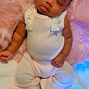 Cali is registered to the contest to win money with this photo: baby, sleeping, infant, soft_blanket, pink_fur, cream_outfit, lace, headband, closed_eyes, peaceful, cute, cozy, child, footwear, small_hands, portrait, indoors, resting, adorable, newborn