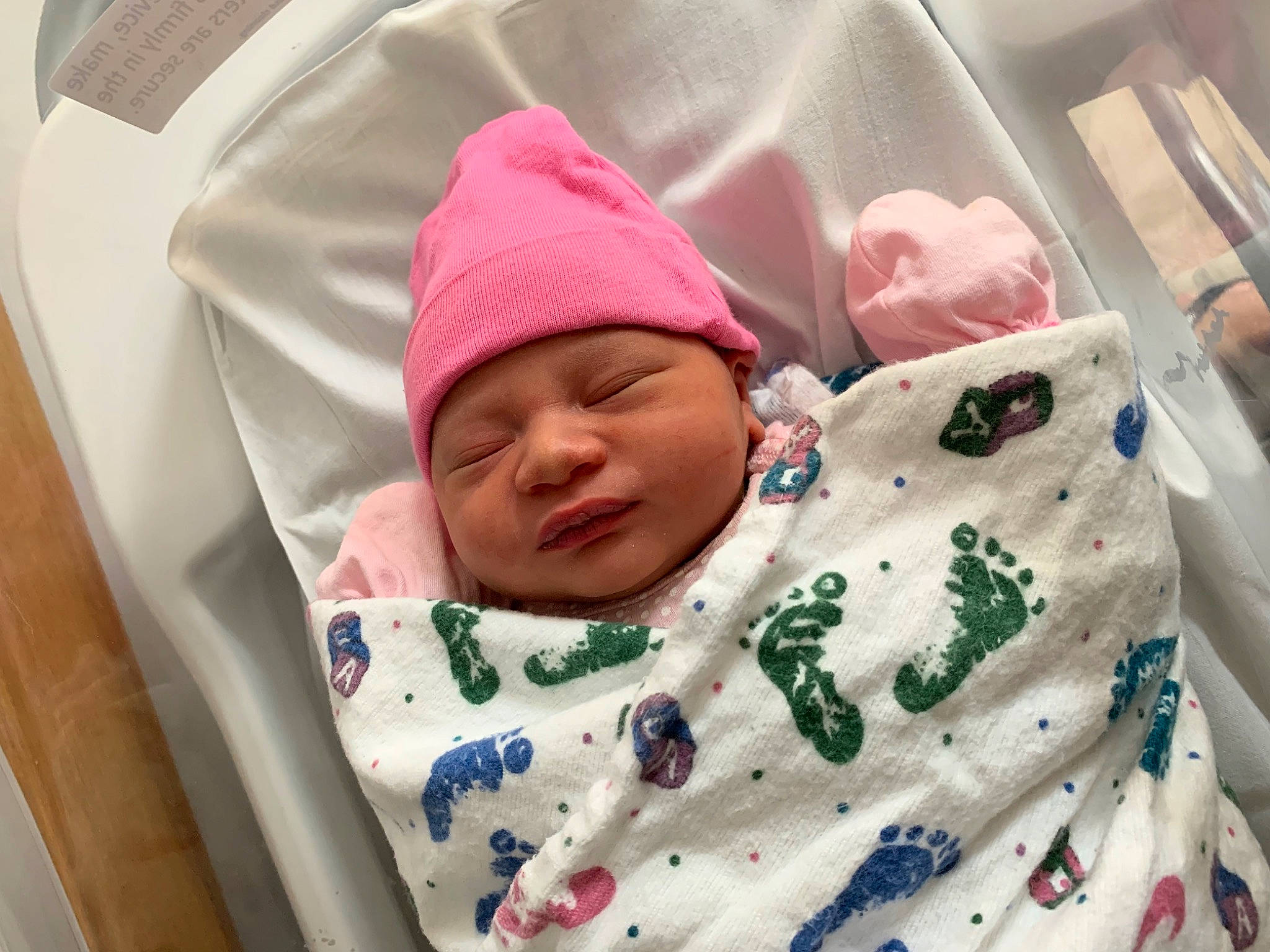 Atlas is registered to the contest to win money with this photo: baby, baby_products, baby_safety, baby_sleeping, baby_toddler_clothing, bedtime, cap, cheek, child, chin, comfort, face, head, headwear, knit_cap, linens, person, pink, product, sleeve