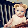 River is registered to the contest to win money with this photo: baby, bare_torso, bear_ears, blue_eyes, child, closeup, crib, cute, eyelashes, hearts, infant, mattress, portrait, railing, sitting, snapchat_filter, soft_light, sparkles, whiskers, wooden_crib