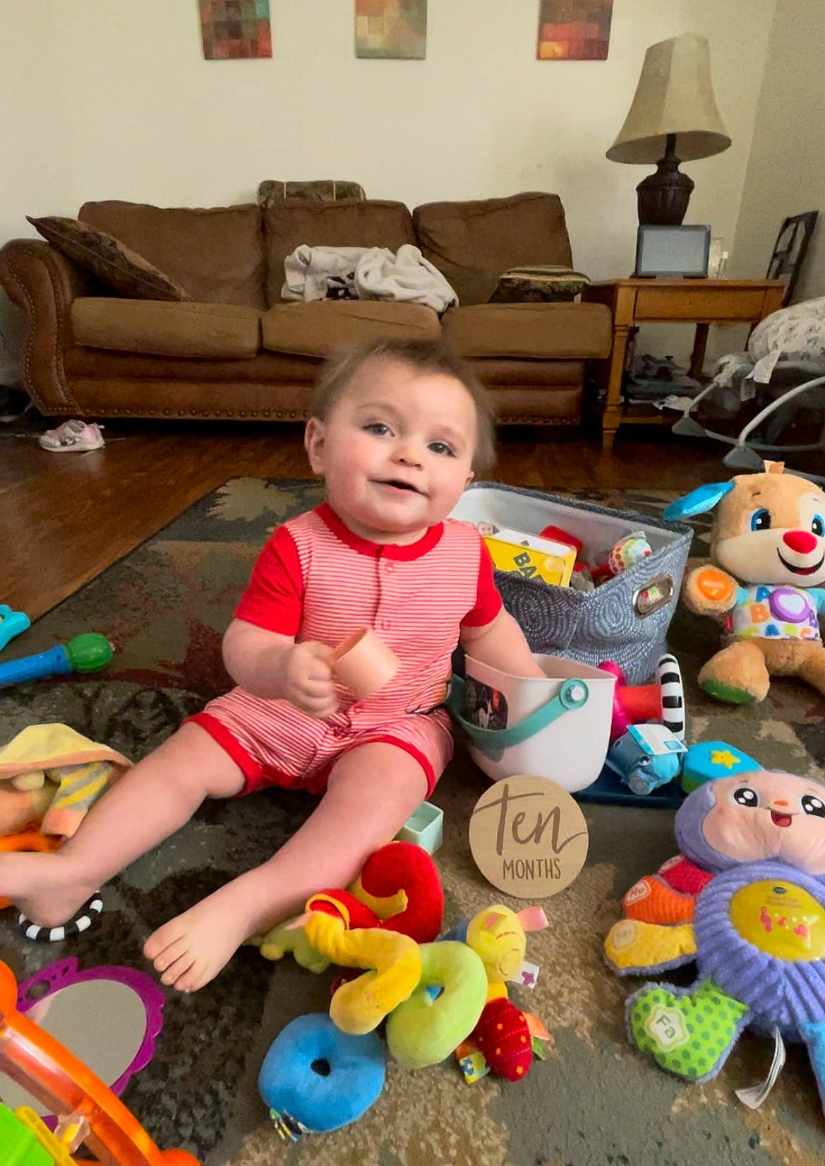 Issac joined the competition — help win amazing prizes! baby, baby_toddler_clothing, baby_toys, child, comfort, couch, flooring, fun, happy, head, joy, lamp, living_room, person, picture_frame, product, skin, smile, stuffed_toy, toddler