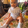 Oliver joined the competition — help win amazing prizes! toddler, child, curly_hair, tablecloth, carrot_pattern, flowers, indoor, lamp, wooden_chair, cute_outfit, bunny_embroidery, socks, smiling, person, home, cozy, portrait, baby, furniture, hands