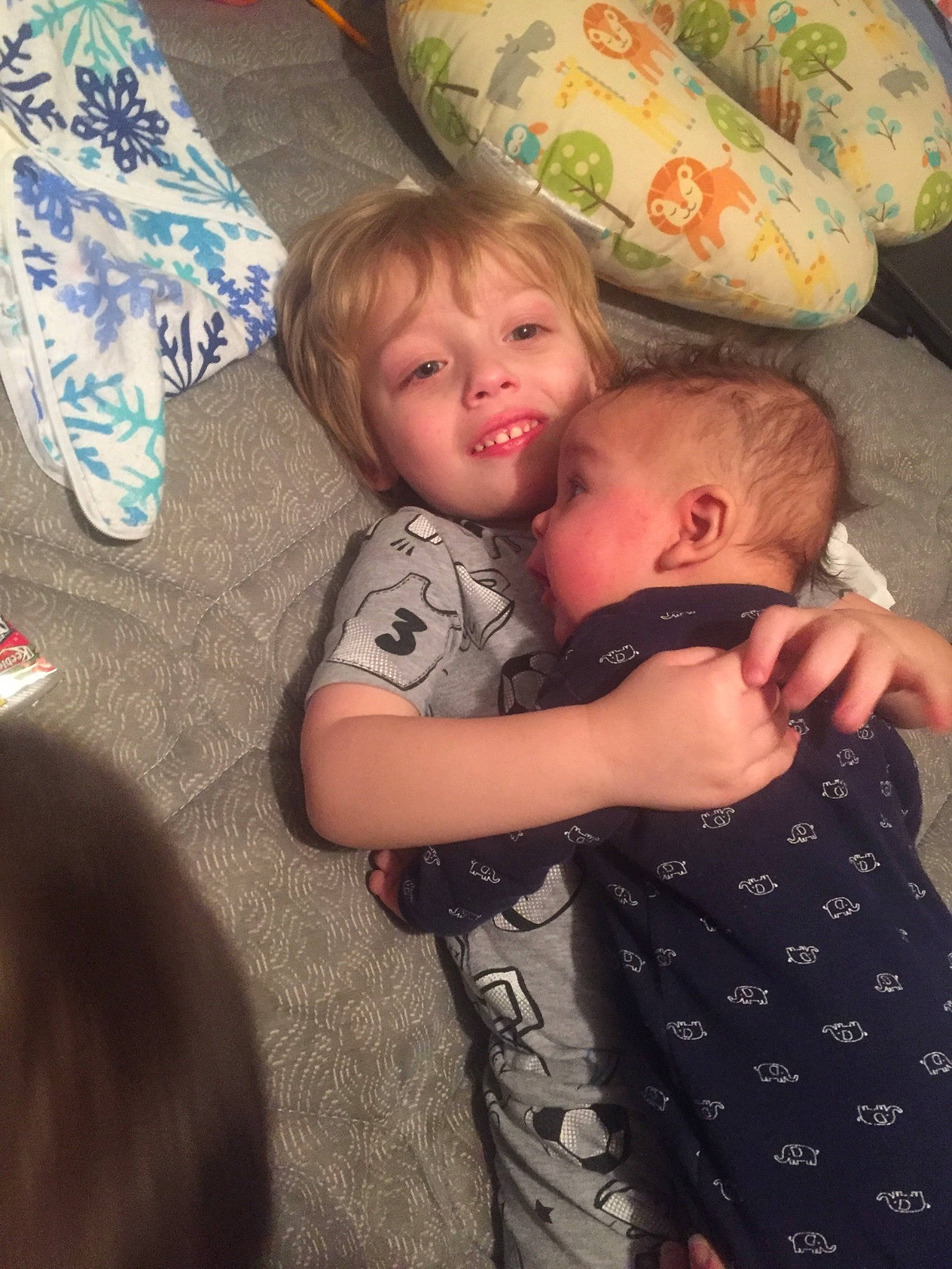 Justin joined the competition — help win amazing prizes! baby, child, eye, fun, hug, interaction, iris, lap, person, sibling, skin, sleep, smile, toddler