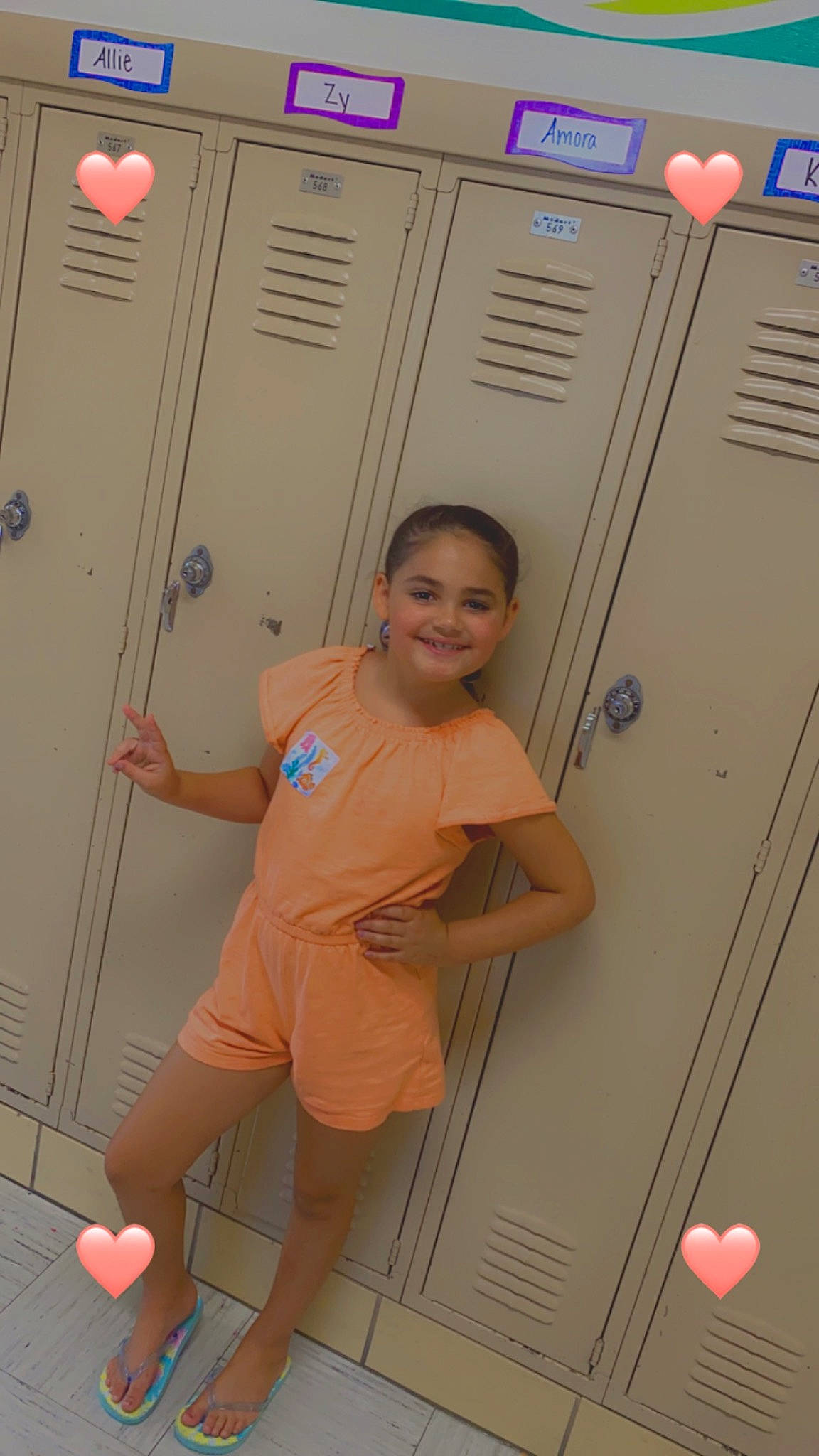 Amora is registered to the contest to win money with this photo: adventure, climbing_hold, electric_blue, fun, human_body, human_leg, joint, joy, knee, leg, leisure, locker, machine, person, recreation, room, shorts, smile, standing, thigh