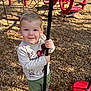 Alex joined the competition — help win amazing prizes! child, toddler, playground, rope, red_platform, wood_chips, outdoor, sunlight, climbing_structure, smiling, blue_eyes, sandals, green_pants, long_sleeve_shirt, play, happy, person, daylight, recreation, fun