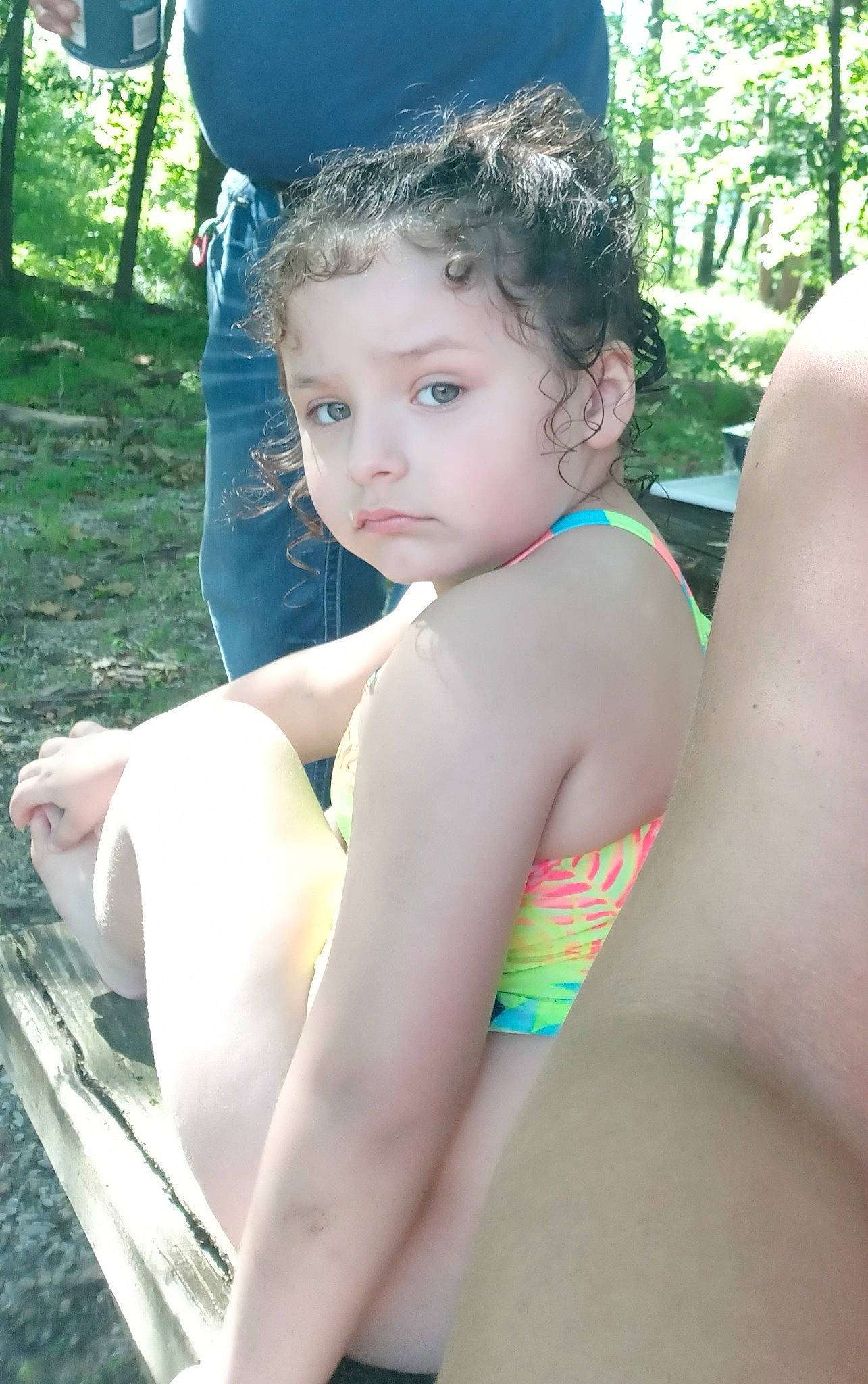 Izaelia is registered to the contest to win money with this photo: abdomen, barechested, beauty, black_hair, chest, child, cool, elbow, finger, fun, grass, human_leg, leisure, person, plant, summer, sunlight, thigh, toddler, tree