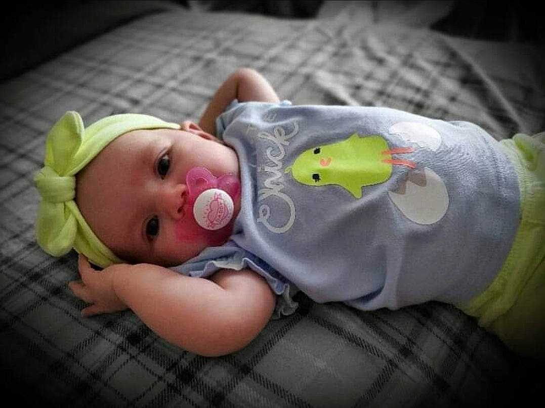 Talia is registered to the contest to win money with this photo: baby, baby_products, baby_toddler_clothing, baby_toys, cheek, child, comfort, eye, grass, happy, head, iris, lip, mouth, nose, person, sitting, skin, toddler, toy