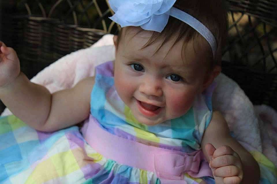 Talia joined the competition — help win amazing prizes! arm, baby, baby_products, baby_toddler_clothing, cap, child, event, finger, fun, gesture, grass, hand, happy, iris, lip, person, pink, skin, smile, thumb