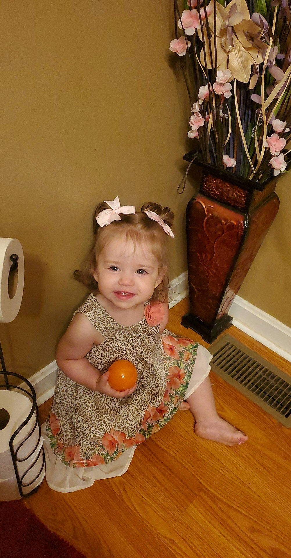 Talia joined the competition — help win amazing prizes! baby, baby_toddler_clothing, child, flooring, flower, flowerpot, fun, happy, hardwood, headpiece, houseplant, joy, organ, paper_towel, person, pink, plant, product, sitting, smile