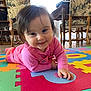Delilah a rejoint le concours — aidez-le/la à gagner de superbes lots ! baby, bookshelf, chair, child, colorful_mat, crawling, cute, face, floor, furniture, hand, happy, home, indoor, person, pink_clothing, play, portrait, smile, wooden_floor