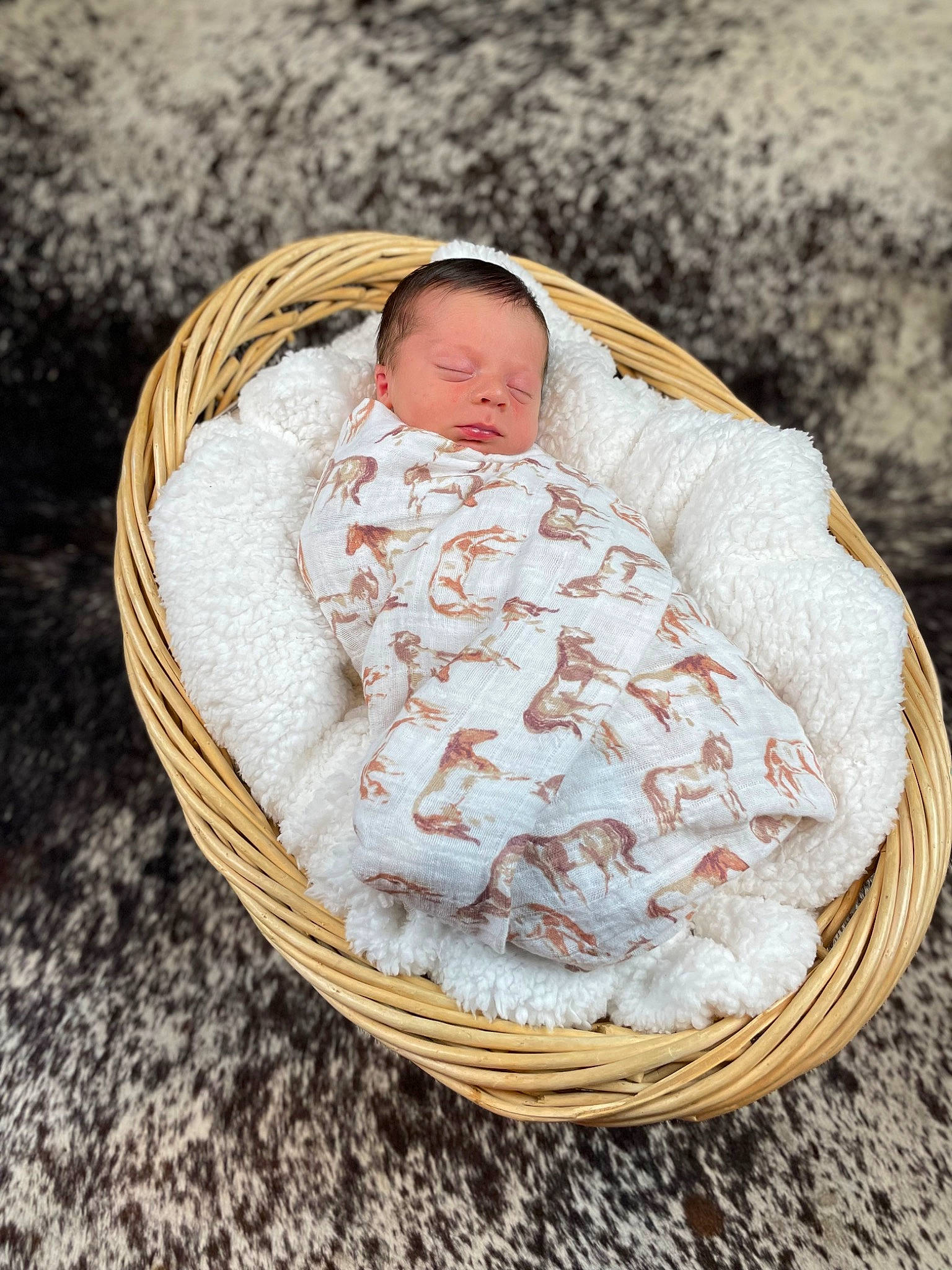 Colt is registered to the contest to win money with this photo: baby, baby_products, baby_sleeping, baby_toddler_clothing, basket, child, circle, comfort, event, fashion_accessory, headgear, infant_bed, linens, natural_material, pattern, peach, person, portrait_photography, textile, toddler