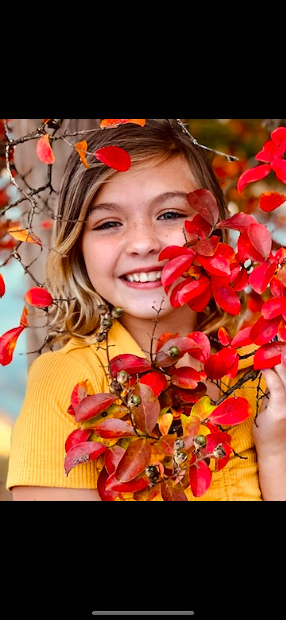 Blaire is registered to the contest to win money with this photo: botany, child, close_up, event, face, facial_expression, floral_design, flower, flower_arranging, grass, happy, jewellery, joy, nature, people_in_nature, person, petal, pink, red, smile