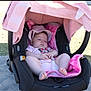 baby, sleeping, car_seat, pink, hat, blanket, outdoor, sunlight, child, toddler, infant, clothing, person, seat, shade, cute, relaxing, summer, rest, peaceful