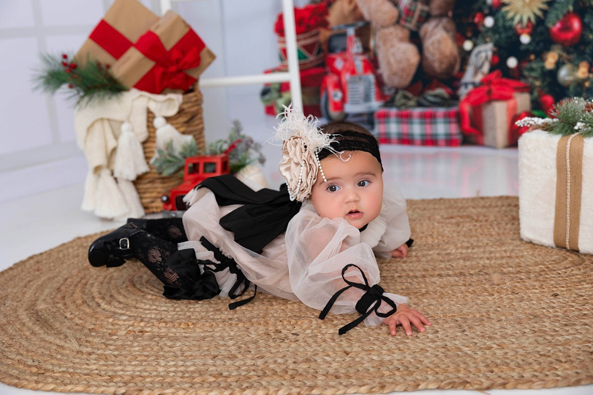 Charli is registered to the contest to win money with this photo: child, christmas, christmas_decoration, christmas_eve, christmas_ornament, doll, dress, event, flooring, happy, headwear, holiday, mammal, ornament, person, plant, red, textile, toy, tradition