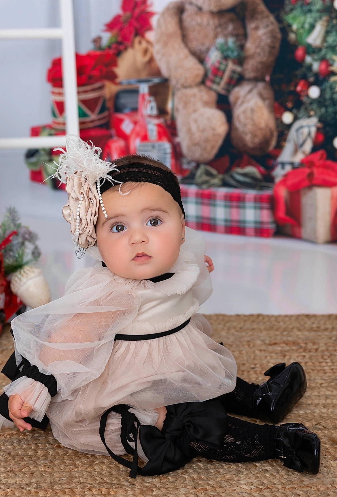Charli joined the competition — help win amazing prizes! baby, baby_toddler_clothing, carmine, christmas, event, flooring, fun, fur, happy, hat, headwear, holiday, human_leg, pattern, person, sitting, street_fashion, textile, toddler, tradition