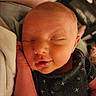 Josiah is registered to the contest to win money with this photo: baby, infant, sleeping, face, hand, clothing, fabric, skin, closeup, portrait, peaceful, cute, newborn, resting, young_child, indoors, soft_lighting, cozy, person, head