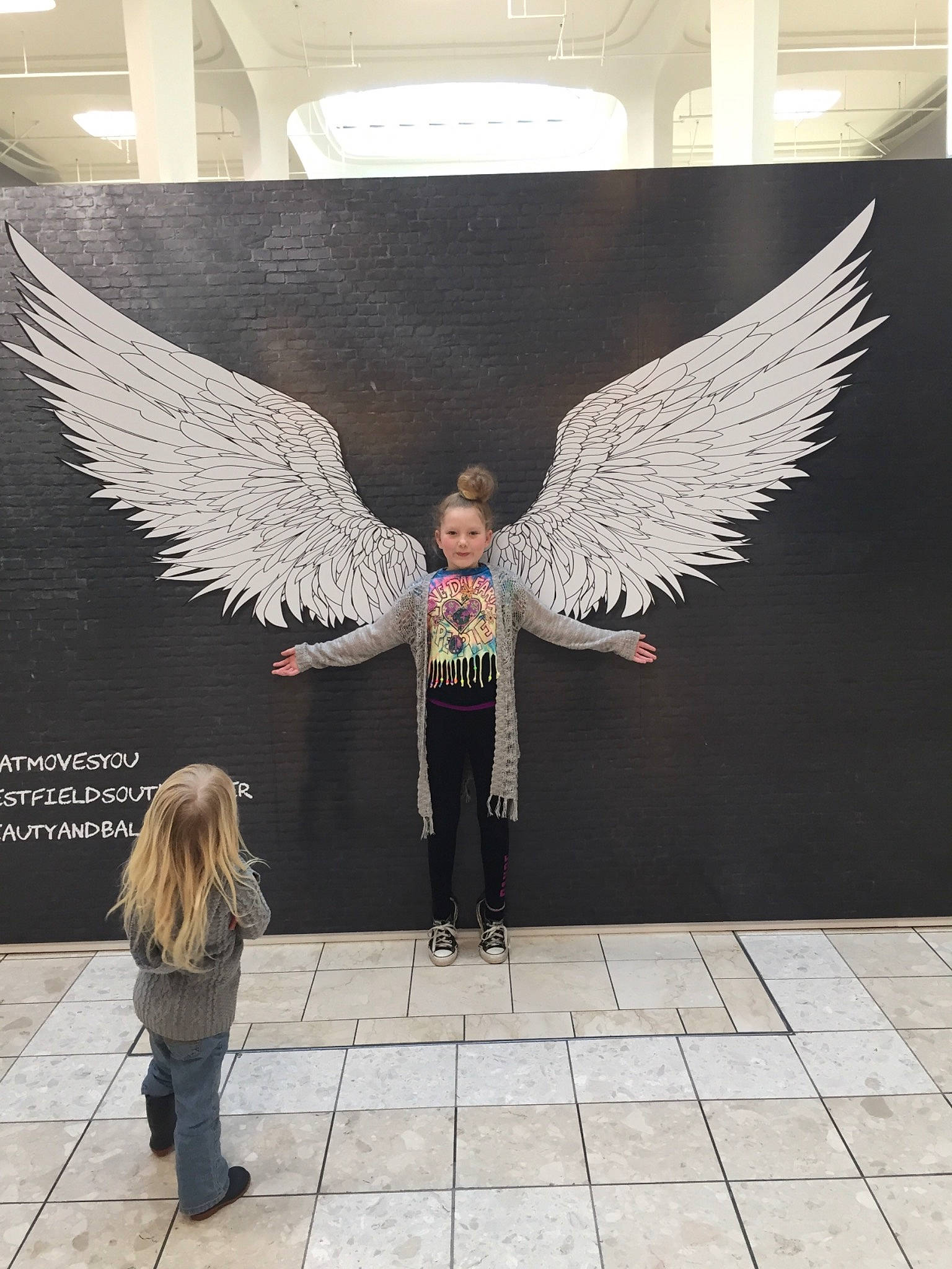 Jaelyn joined the competition — help win amazing prizes! angel, architecture, art, fashion, feather, fictional_character, person, sculpture, tourist_attraction, wall, wing