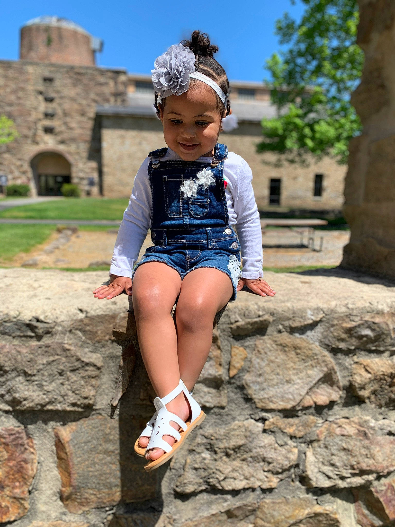 Peyton joined the competition — help win amazing prizes! beauty, blue, child, child_model, fun, headwear, joy, leg, leisure, person, photo_shoot, photography, rock, ruins, sitting, smile, stone_wall, summer, temple, toddler